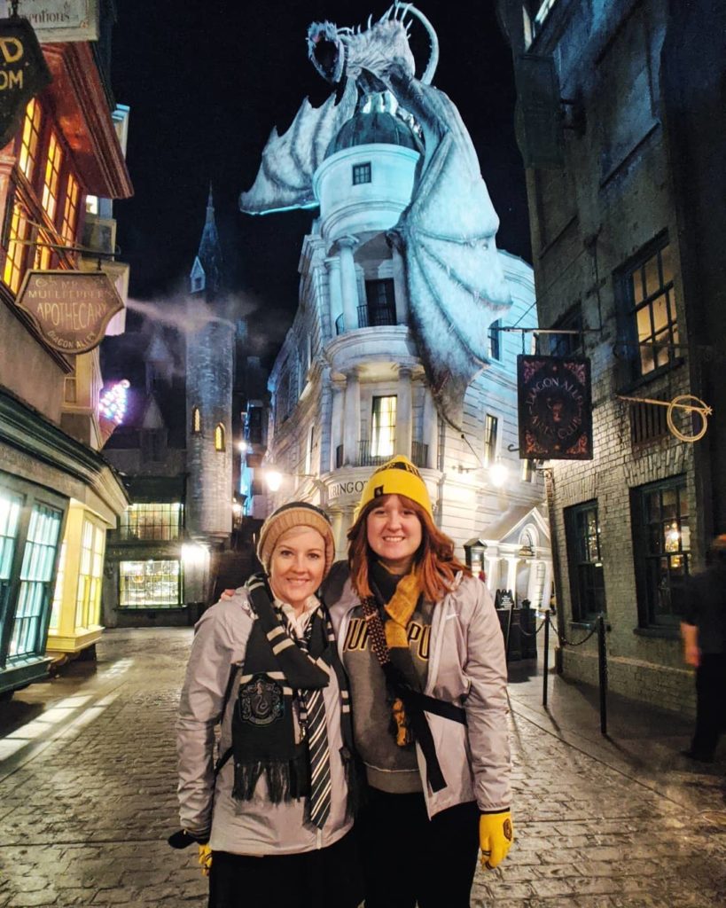 Two girls standing in Diagon Alley in Universal Studios Florida