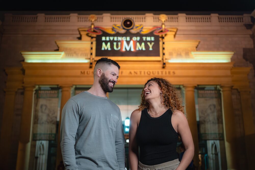 A man and woman in front of Revenge of the Mummy at Universal Studios Florida